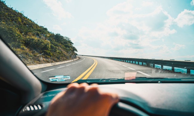 Personal perspective of person driving on mountain road