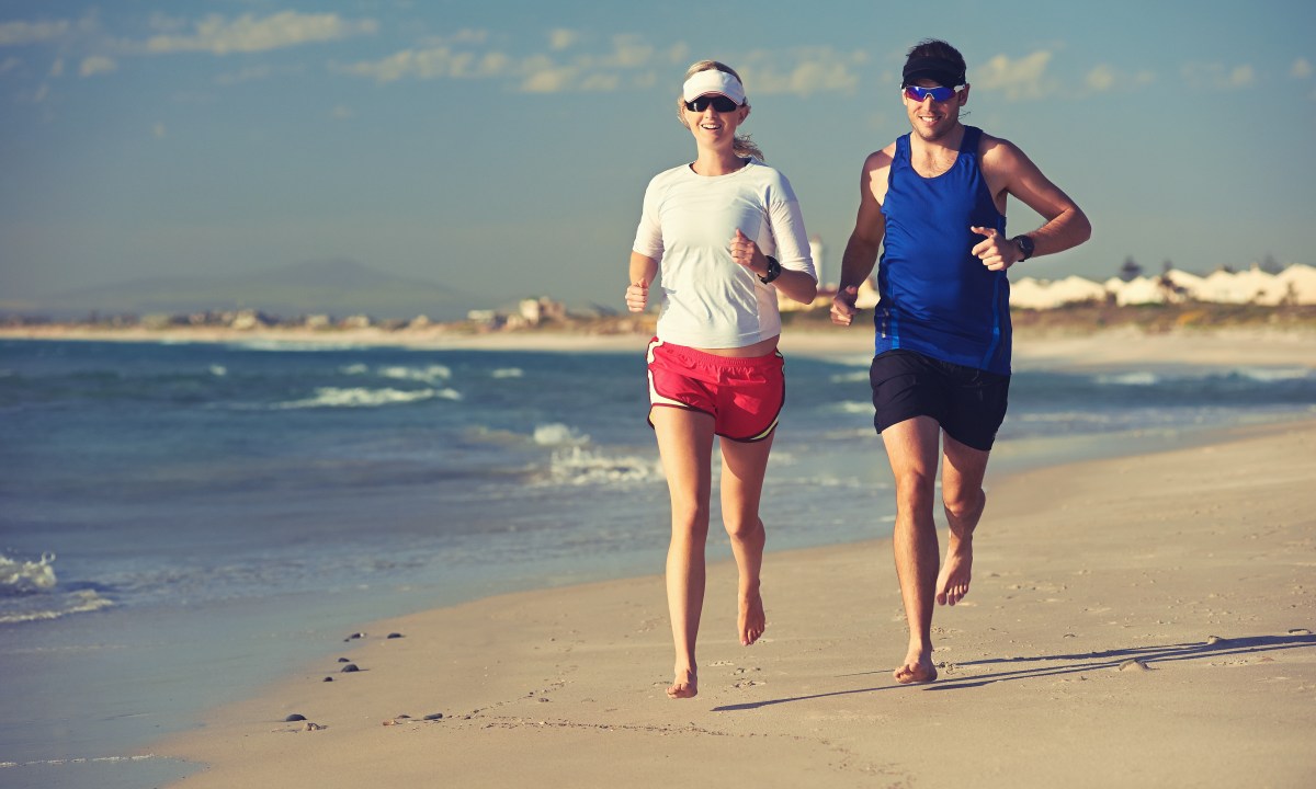 Couple running on beach