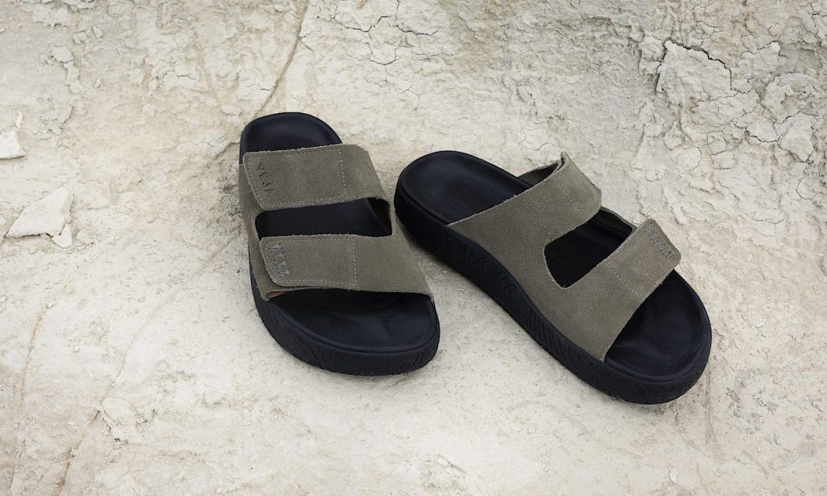 dark green suede veja sandals on rocks